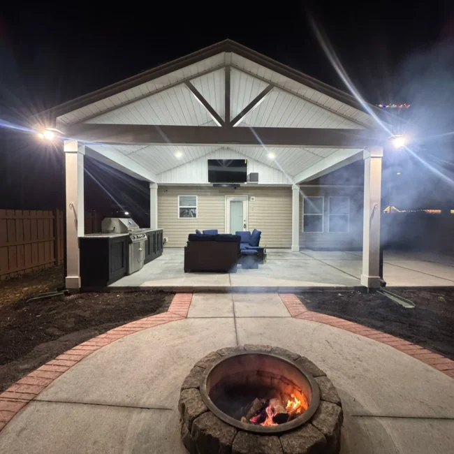 Custom outdoor kitchen, patio, and fire pit by Ubaldo Construction